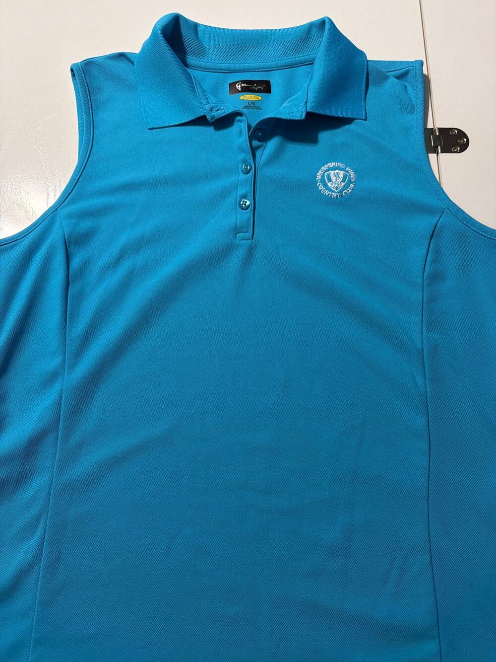 Women’s Large sleeveless golf shirt by Greg Norman
